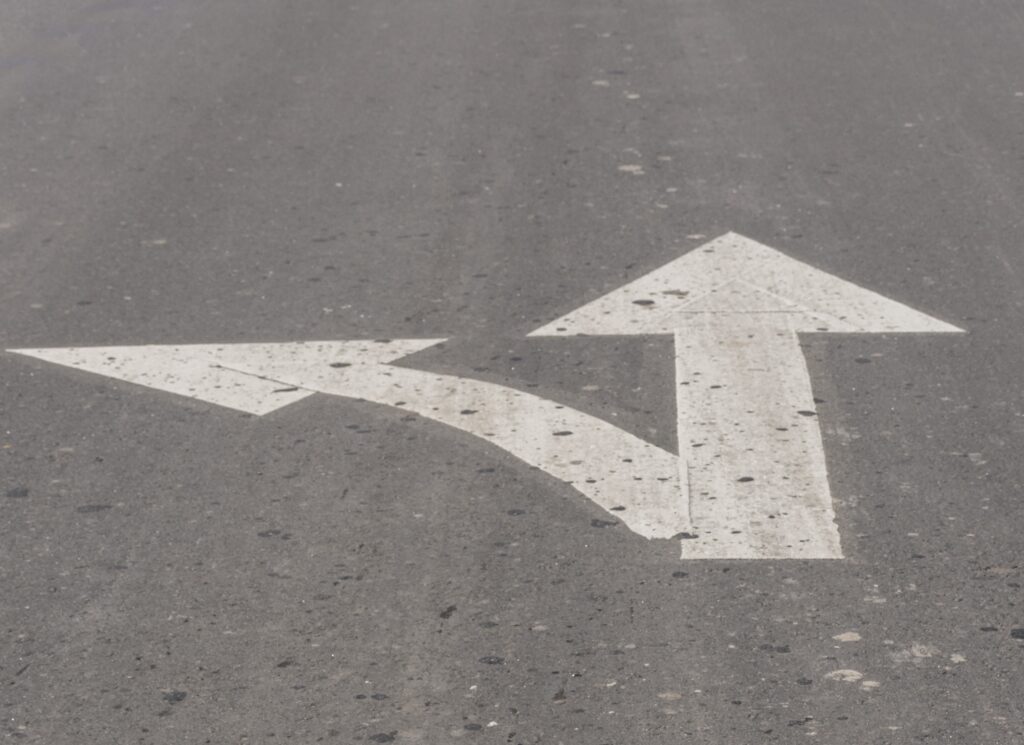 Directional arrows at a crossroads