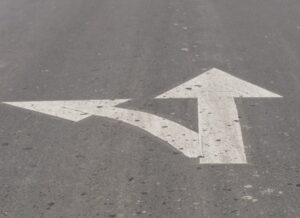 Directional arrows at a crossroads